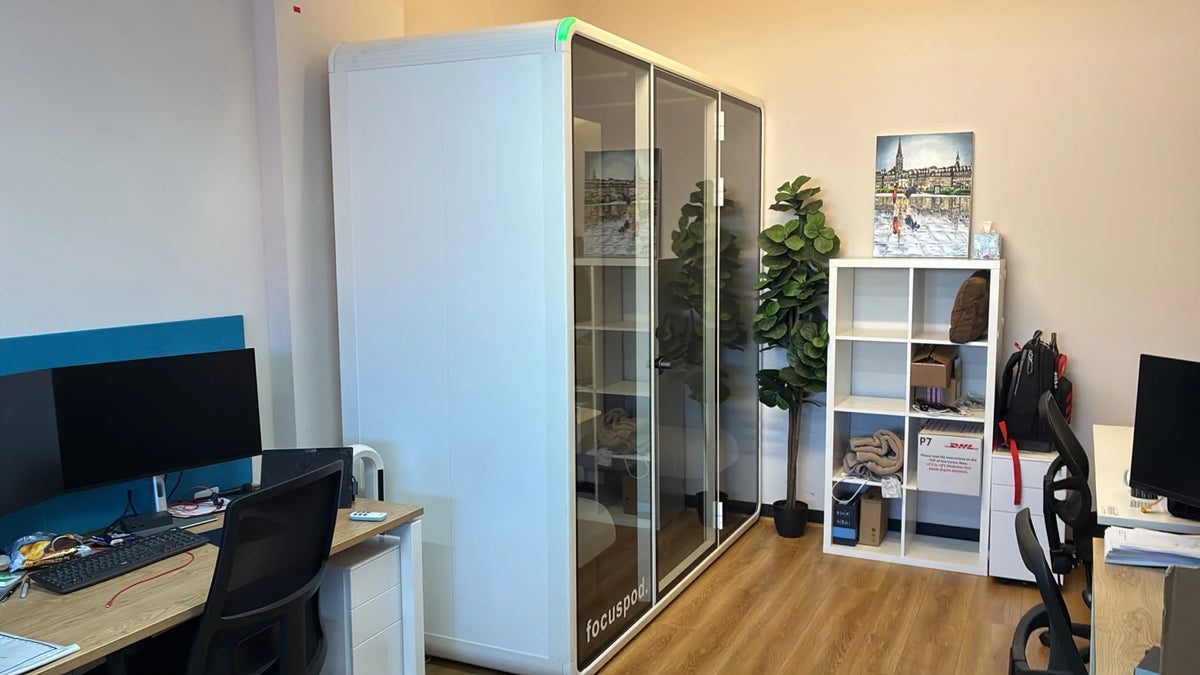 White FocusPod Team with a glass frontage beside desks and shelving in a Melbourne life sciences office.